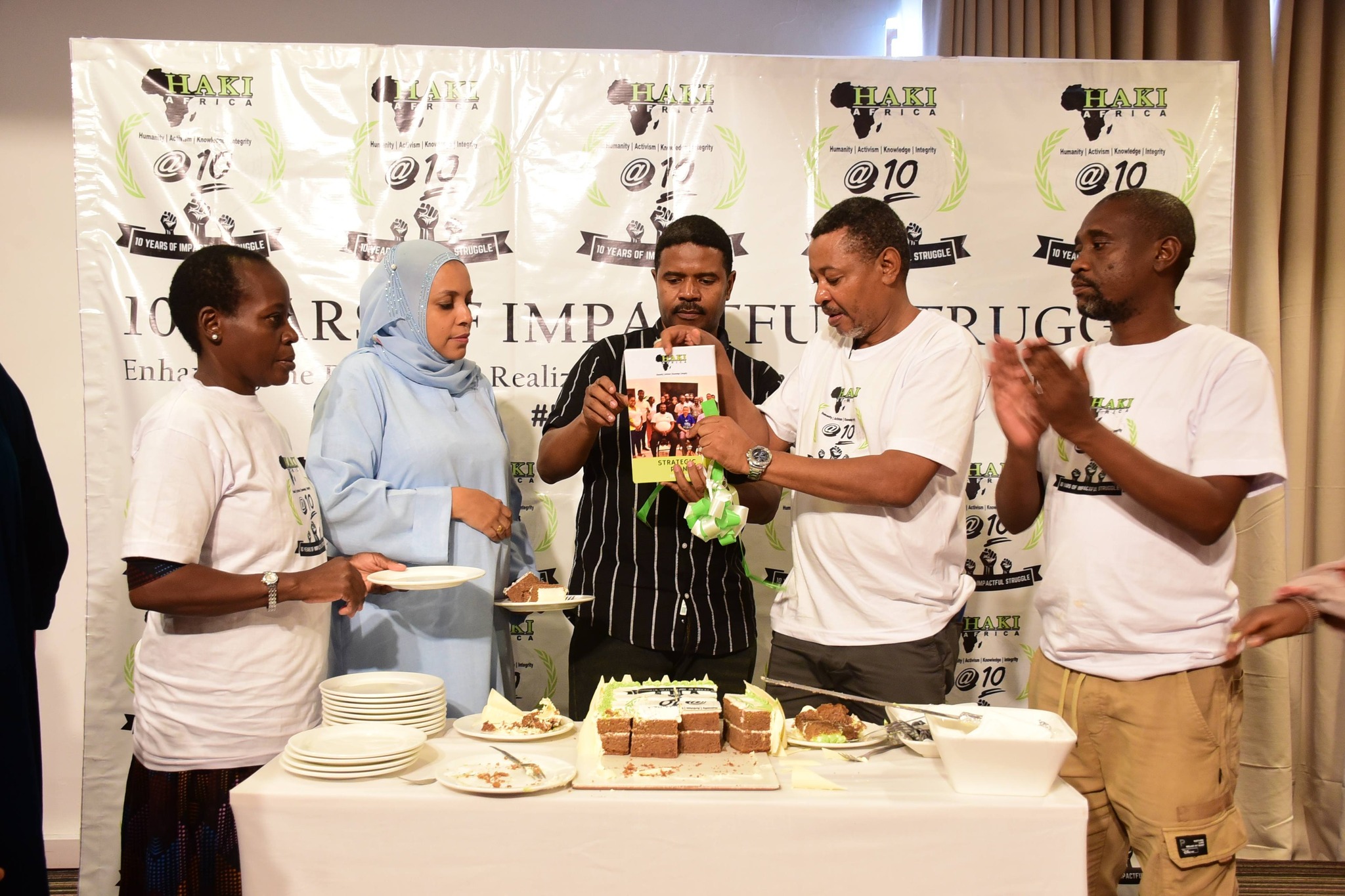 Haki Africa Mombasa 10th anniversary celebrations at PrideInn Resort with officials cutting cake