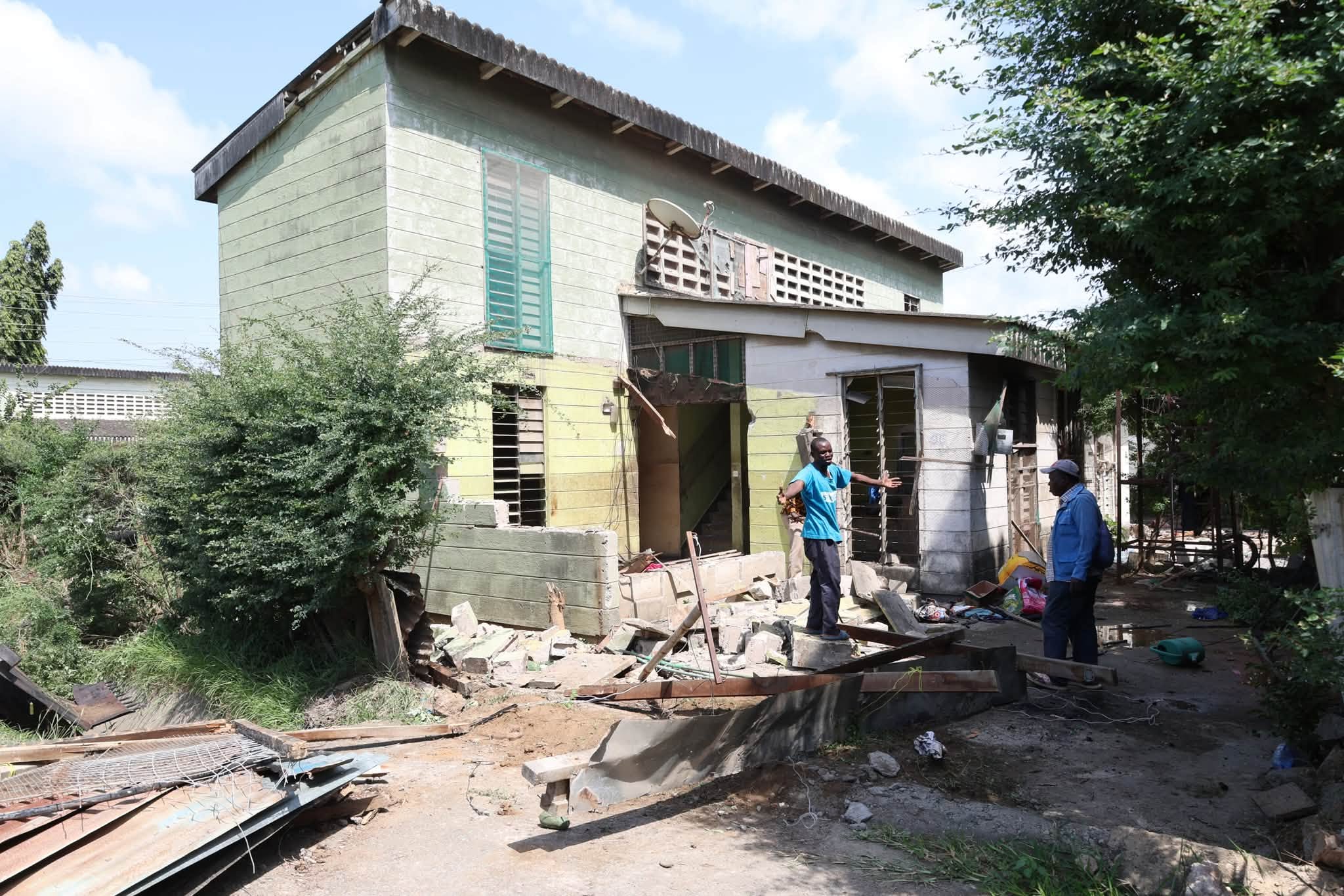 Changamwe housing demolition aftermath — debris outside a partially razed house in Mombasa